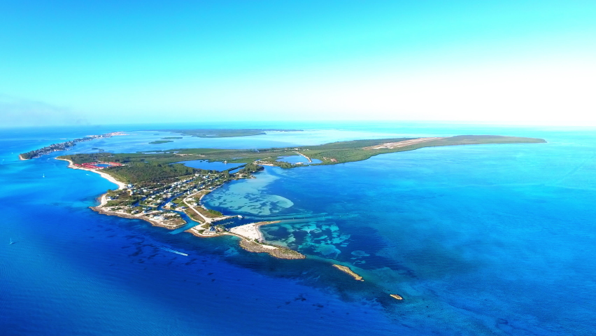 Aerial Upward Idyllic Shot Of Island On Blue Sea Against Sky - Bimini, The Bahamas Royalty-Free Stock Footage #1093526175