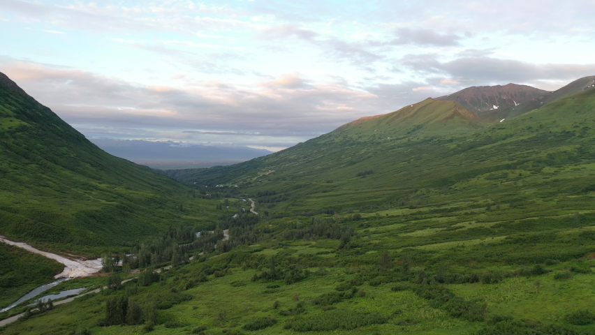 Aerial view of Hatcher Pass, Alaska. Mountain pass through the Talkeetna Mountains from above. Summer Alaskan landscape 
