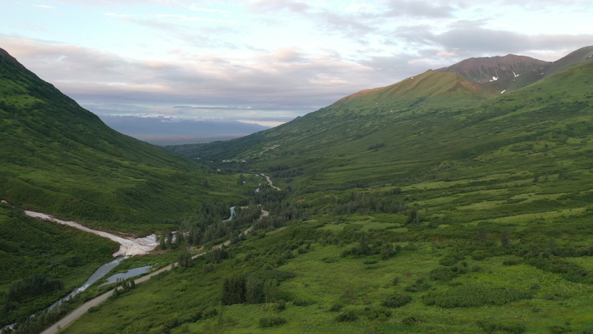 Aerial view of Hatcher Pass, Alaska. Mountain pass through the Talkeetna Mountains from above. Summer Alaskan landscape 