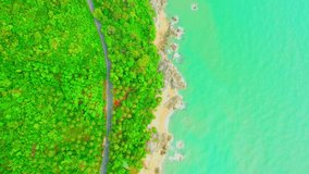 Drones fly over Khanom-Sichon Road, a beautiful viewpoint. Coastal road. Lots of coconut trees. tropical summer scenery. Nakhon Si Thammarat, Thailand. 4K drones
