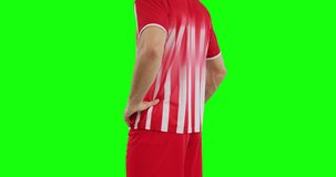 Video of caucasian male soccer player with ball on green screen background. Soccer, football, sports and competition concept.