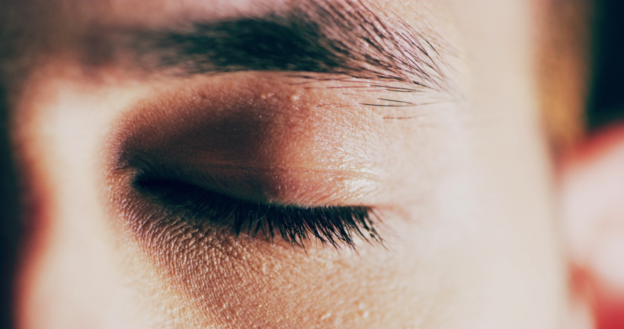 Portrait, vision and green eye of man staring with microblading and zoom focus. Natural face, skin or blue eyeball of male, human or person with beautiful eyebrow while staring with light reflection