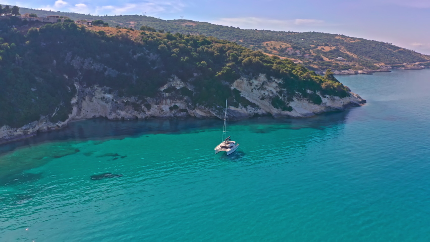 White catamaran boat on transparent water of ionian islands sea in Zakynthos