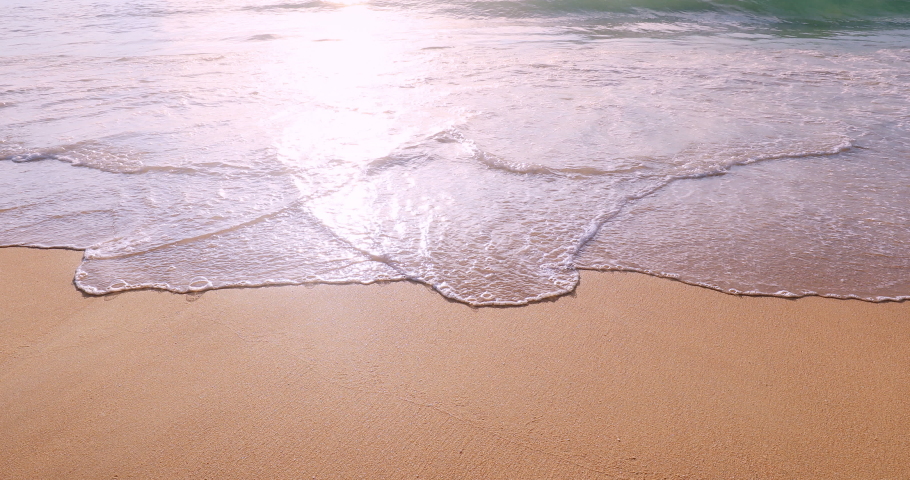 Meditative and serene beach background. Slow motion wave on empty beach