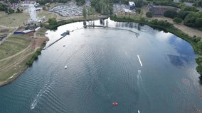 Beautiful Aerial Drone's Camera  Footage of Willen Lake and Park which is located at Milton Keynes, England.People are Enjoying at Lake on a Hot Sunny Day of Summer. Video Clip Captured on 21-8-2022
