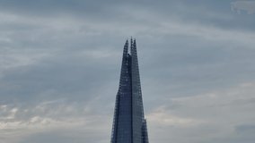 The Shard iconic London skyscraper moody sunset Drone Aerial establishing shot close up slow vertical pan