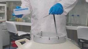 Laboratory samples are taken from a liquid nitrogen fridge - Powered by Shutterstock - Get 15% off with code: PIKWIZARD15