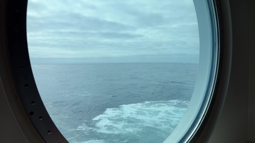 Rough seas through a big porthole on a luxury cruise ship Royalty-Free Stock Footage #1093580809