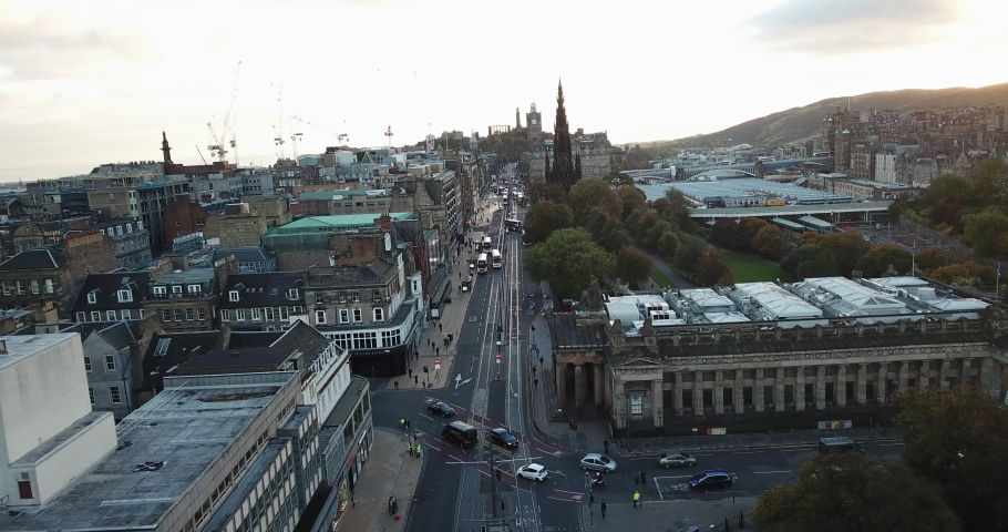 Sunrise drone shot of Princes Street, Edinburgh.