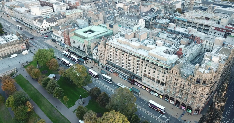 Impressive 4k drone shot of Princes Street, Edinburgh. The shot pans along the street from Scott Monument.