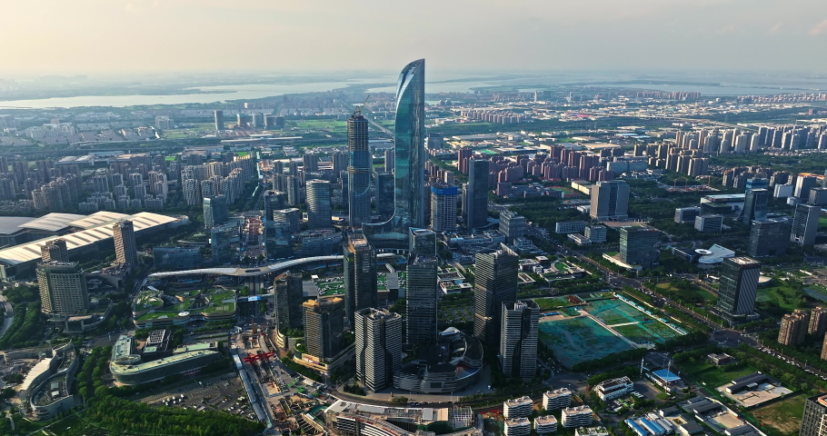 Aerial footage of city skyline and modern commercial buildings in Suzhou, China.