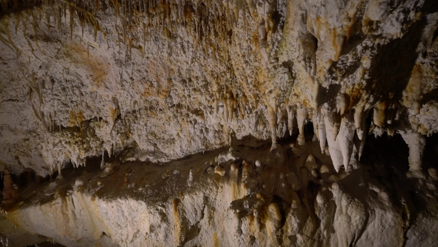 Stalactites in a cave in Slovakia. Natural mineral formation underground Royalty-Free Stock Footage #1093588951