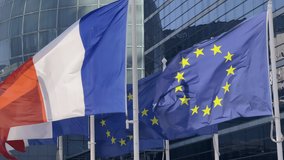 France and EU flag on flagpole excellent quality. French Republic and The European Union waving flag in wind background building glass skyscraper in Paris - Powered by Shutterstock - Get 15% off with code: PIKWIZARD15