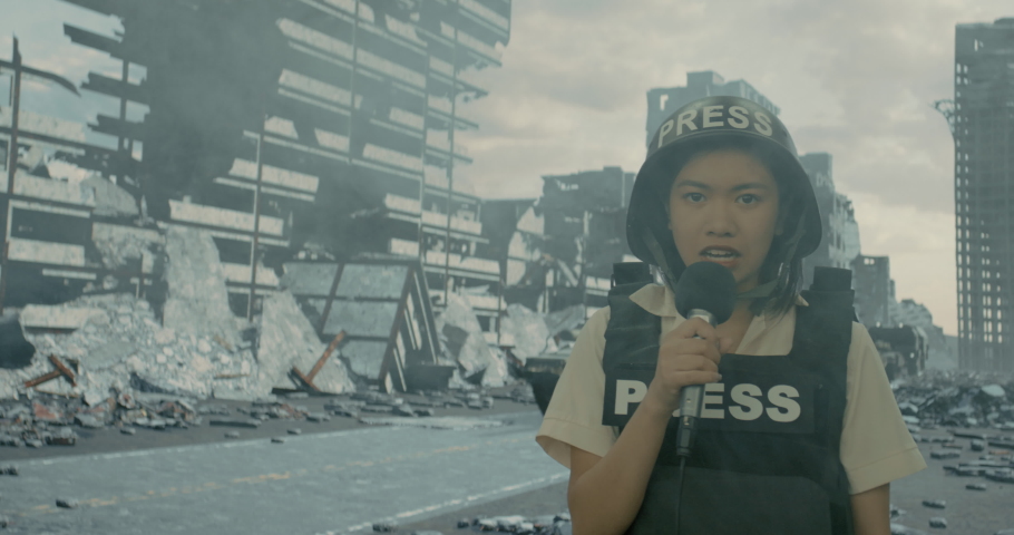 A war reporter female reporting from the ruined city on the background of a passing convoy of tanks. High quality 4k footage