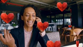 Animation of red hearts over biracial businesswoman using smartphone. Global social media, love, valentine's day, data processing and networking concept digitally generated video. - Powered by Shutterstock - Get 15% off with code: PIKWIZARD15