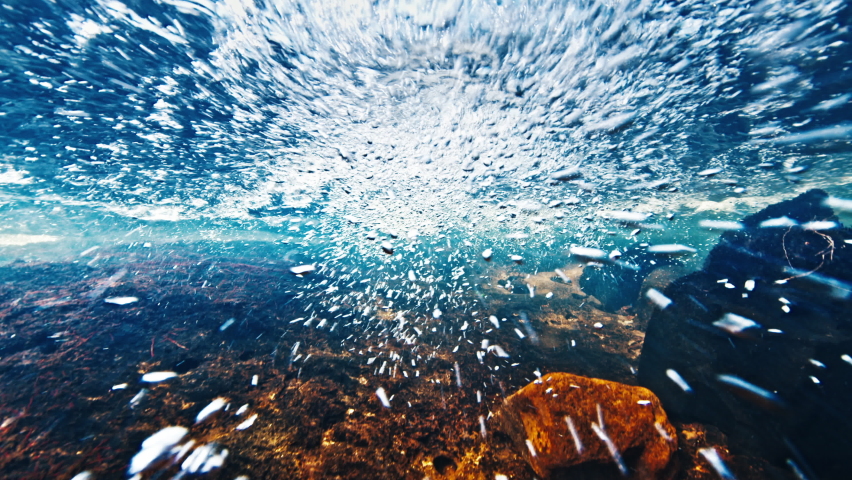 Clean mountain river. Underwater view of the rapid clean river with rocky bottom flowing in Brazilian mountains