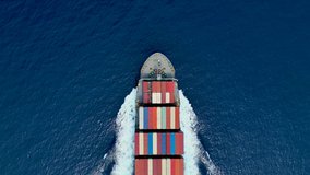 Aerial top down view of a bow from a large container cargo ship traveling with speed over blue ocean - Powered by Shutterstock - Get 15% off with code: PIKWIZARD15