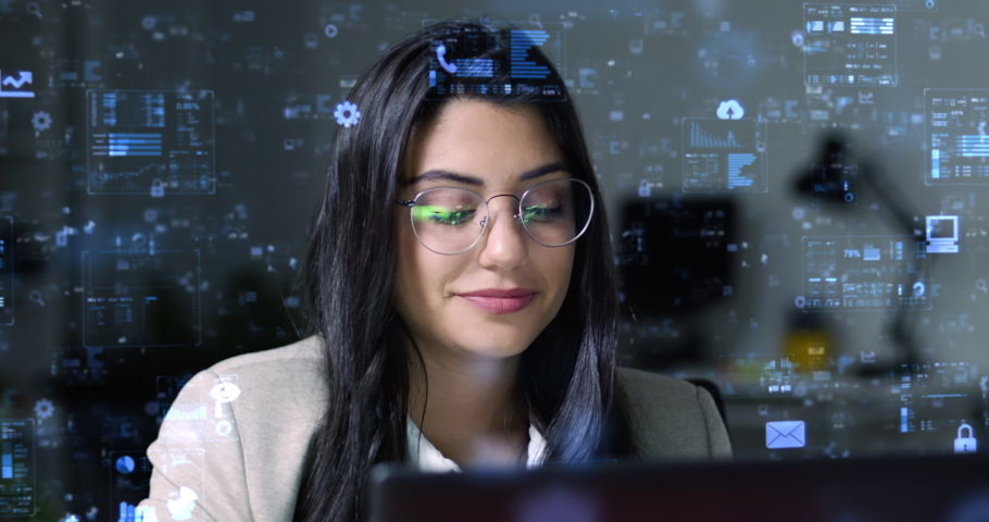 Young Pretty Woman Using Laptop Computer With Holographic Animated Financial Charts and Data. Broker Businesswoman Checking Stock Exchange Information in Office. VR, AR. GUI. Royalty-Free Stock Footage #1093605065