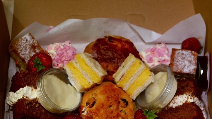 Selection of cakes and sweets for afternoon tea medium zoom flat lay selective focus