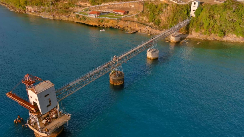 Full View Zoom In Drone Shot of a Sugar Cane Pier (Muelle de Azúcar) located in Aguadilla, Puerto Rico.