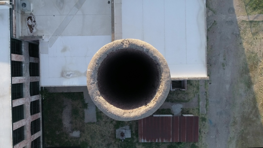 straight down view of a smoke stack at the cotton mill for releasing steam from the engine in McKinney Texas Royalty-Free Stock Footage #1093615457