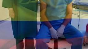 Animation of flag of columbia over diverse surgeons in operating room. Health, medicine and national medical care concept digitally generated video.