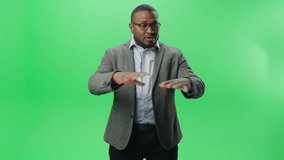 Green Screen Background: Black Businessman Explaining Concept. Handsome African American Entrepreneur, Talks about His e-Business Startup. Formal Dressed Successful Startup Owner Pitches his Vision - Powered by Shutterstock - Get 15% off with code: PIKWIZARD15