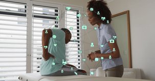 Animation of connections over africna american female doctor and patient with back pain. , health and medicine concept digitally generated video.
