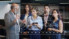 A futuristic Indian Asian old or elderly businessman in formal corporate attire busy interacting with office team colleagues uses hand gestures to create a 3D VFX animated graph to show company growth - Powered by Shutterstock - Get 15% off with code: PIKWIZARD15