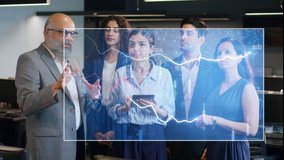 A futuristic Indian Asian old or elderly businessman in formal corporate attire busy interacting with office team colleagues uses hand gestures to create a 3D VFX animated stock market graph or chart. - Powered by Shutterstock - Get 15% off with code: PIKWIZARD15