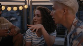 Group of friends have a fun on evening in top of the roof. Shot with RED helium camera in 8K.  - Powered by Shutterstock - Get 15% off with code: PIKWIZARD15