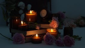 A set of different aroma candles in brown glass jars and flowers. Scented handmade candle. Soy candles are burning in a jar. Aromatherapy and relax in spa and home. Fire in brown jar. Dark evening - Powered by Shutterstock - Get 15% off with code: PIKWIZARD15