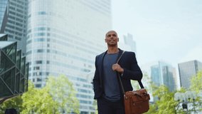 Cinematic storytelling video of a young businessman going around in the city. Successful modern sales man with suit and casual tshirt ready for an another great working day - Powered by Shutterstock - Get 15% off with code: PIKWIZARD15