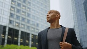 Cinematic storytelling video of a young businessman going around in the city. Successful modern sales man with suit and casual tshirt ready for an another great working day - Powered by Shutterstock - Get 15% off with code: PIKWIZARD15