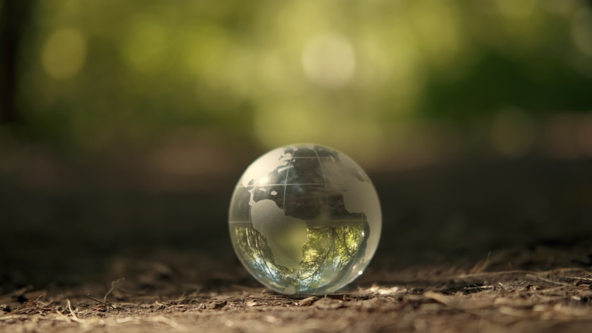 Human hands cover a glass globe.Earth Day, Save Planet, Save the world, Love Nature. Royalty-Free Stock Footage #1093649145