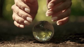 Human hands cover a glass globe.Earth Day, Save Planet, Save the world, Love Nature. - Powered by Shutterstock - Get 15% off with code: PIKWIZARD15