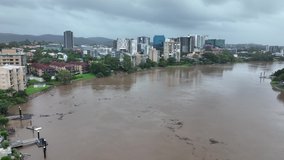 Drone shot of flooded Brisbane river filled with debris. Brisbane Floods Drone Video 2022 QLD AUS