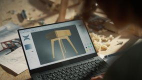 Over the Shoulder Close Up Shot of a Furniture Designer Working on Laptop Computer, Creating a Digital 3D Model of a Stylish Bedside Table. Creative Person Preparing a Design for Carpentry Project. - Powered by Shutterstock - Get 15% off with code: PIKWIZARD15