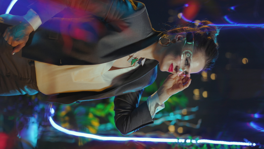 smiling stylish middle aged business woman with futuristic goggles welcoming in metaverse.