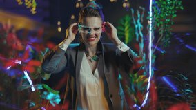 happy trendy business woman with futuristic goggles giving hand for a handshake in metaverse. - Powered by Shutterstock - Get 15% off with code: PIKWIZARD15