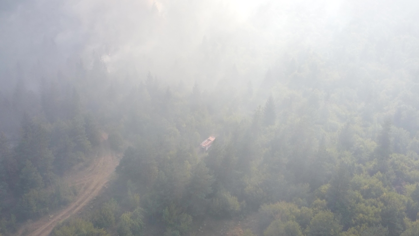 A fire engine is trying to put out the fire in the forest - 
Fire in Borjomi
 Royalty-Free Stock Footage #1093682177