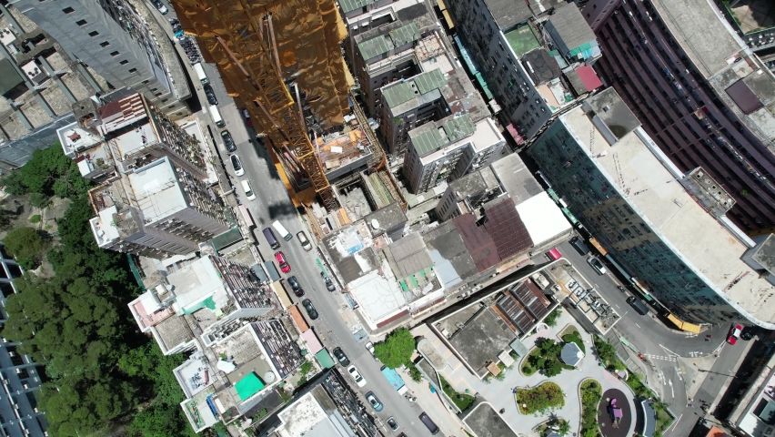 Commercial and residential construction development project in Kwun Tong of Hong Kong city, becoming the newest business district near Kowloon Bay and Victoria harbor, Aerial drone skyview | Shutterstock HD Video #1093683521