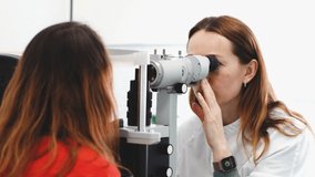 Eye test for visual acuity. The patient receives eye consultation. High quality 4k footage - Powered by Shutterstock - Get 15% off with code: PIKWIZARD15