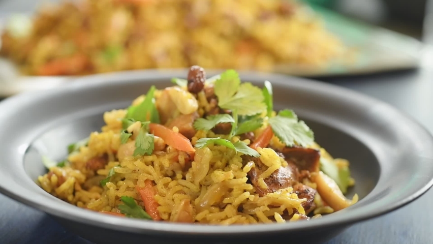 Eating the freshly prepared chicken pilaf.