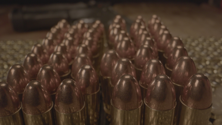 Macro shot of 9mm bullets with smoke passing