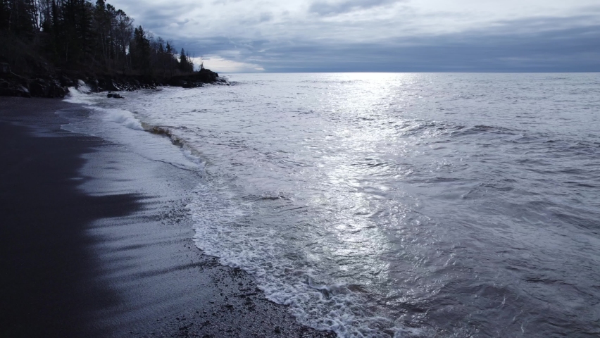 Aerial clip of waves breaking along the shoreline of Lake Superior in northern Minnesota