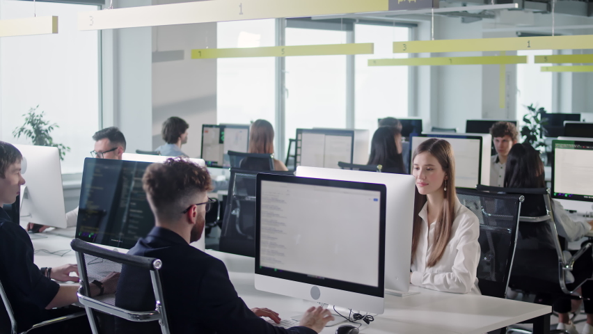 Modern Open Space Office Businessmen and Businesswomen Working in room with large window and view to nature. Positive mood in work collective. Modern open space office interior. | Shutterstock HD Video #1093708407