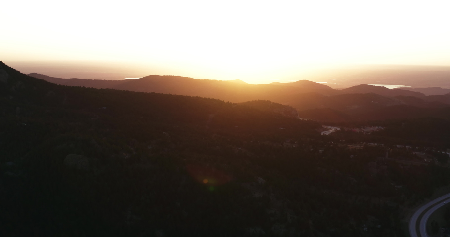 Aerial sunset in the mountains over mountain roads
 Royalty-Free Stock Footage #1093709665