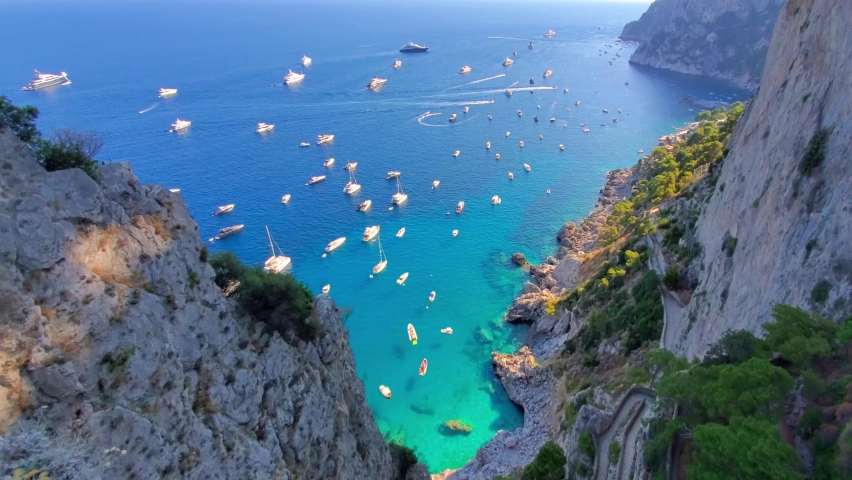 Italy, scenic views of Capri Island and faraglioni rock formations from Augustus Gardens. Royalty-Free Stock Footage #1093712393