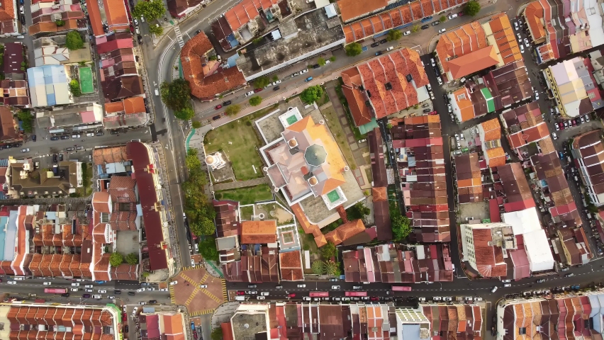 George Town, Malaysia: Aerial top down drone footage of the historic George Town UNESCO city center with the Kapitan Keling Mosque in Penang island. 
